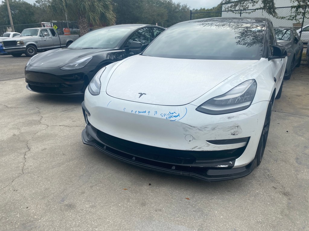 Tesla accident damage being repaired at The Shop in Bradenton