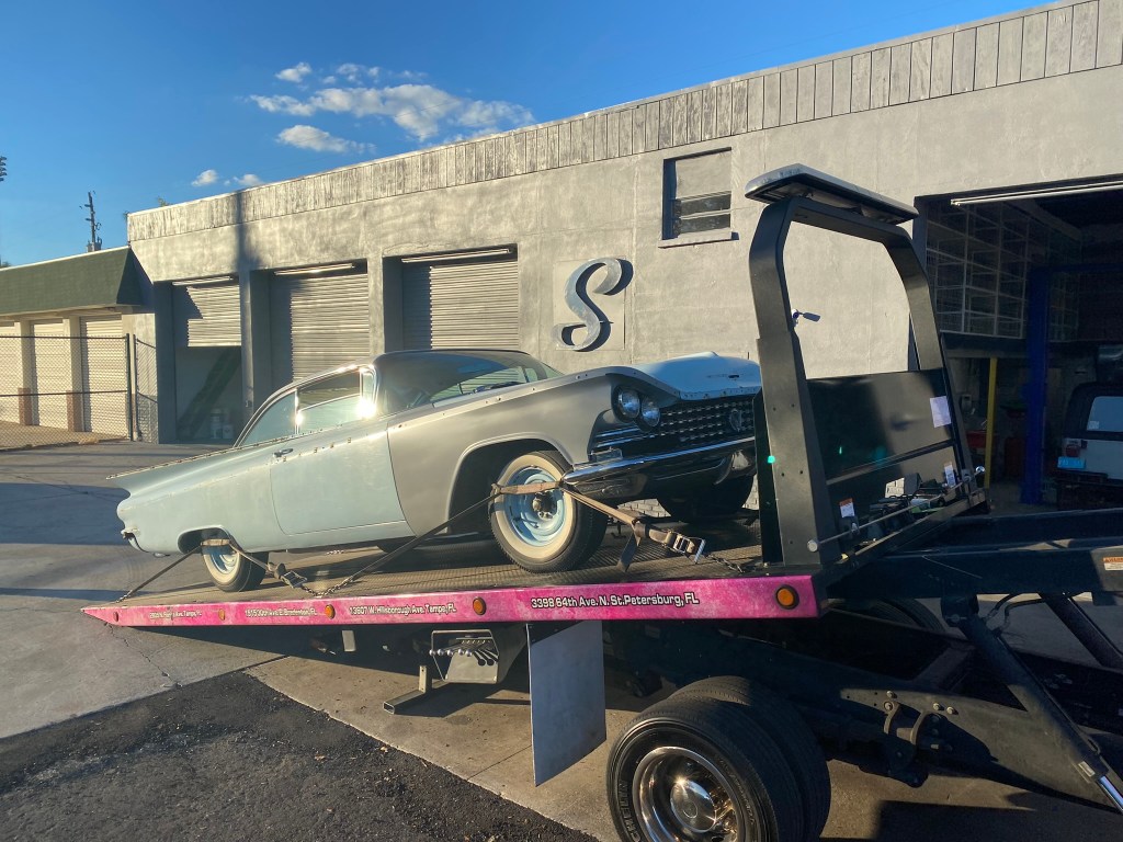 Classic Buick being delivered for auto body and paint