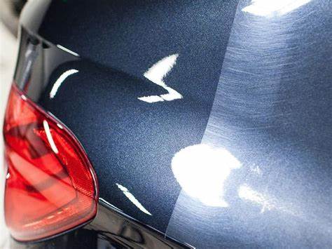 A car being wet sanded to remove imperfections in the paint