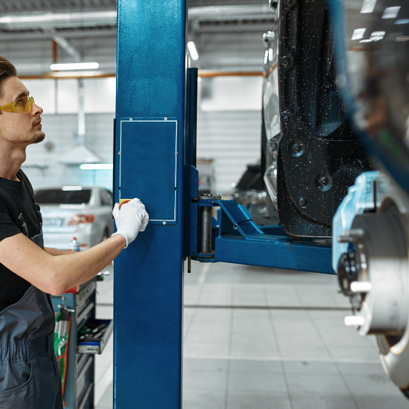 Automotive lift being used for car repair