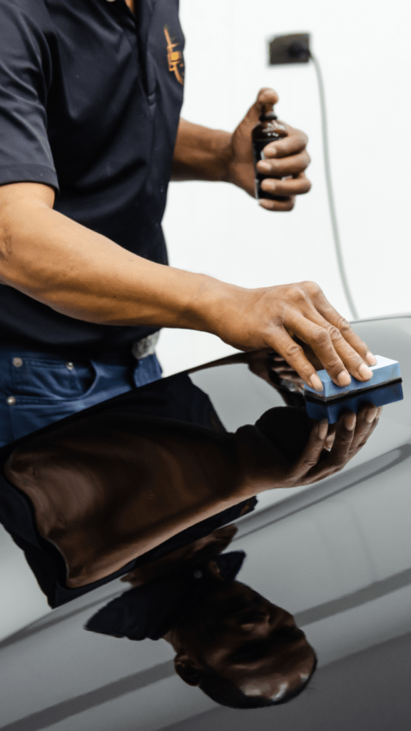Ceramic coating being applied to a cars paint finish.